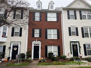 a front view of a house with yard