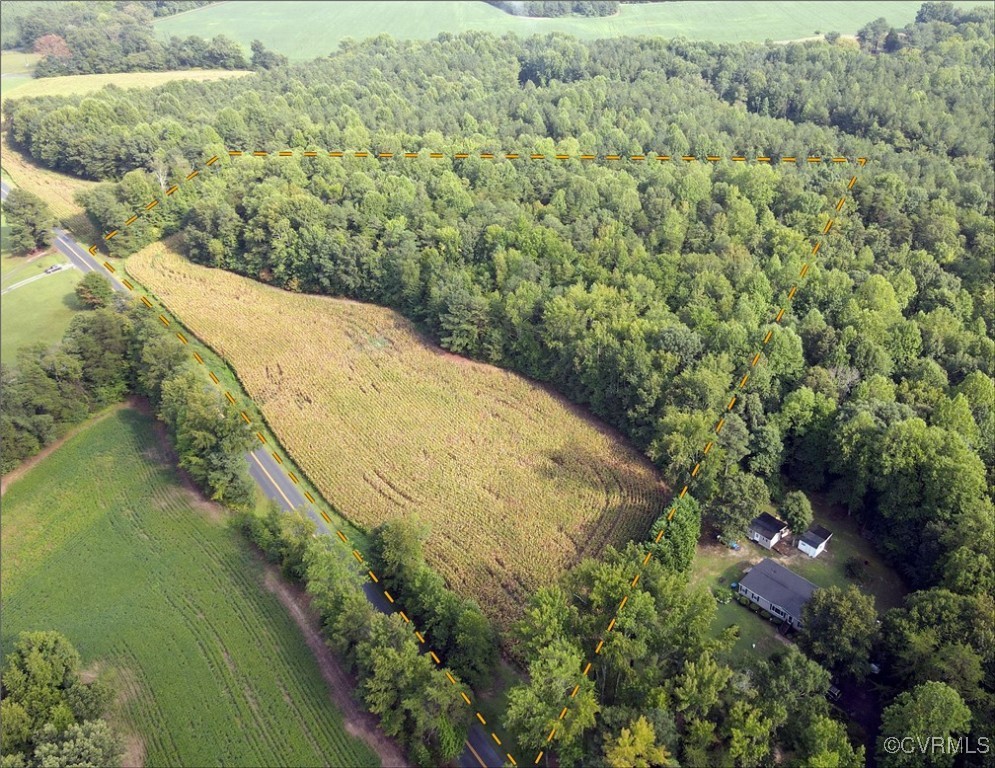 Birds eye view of property with a rural view