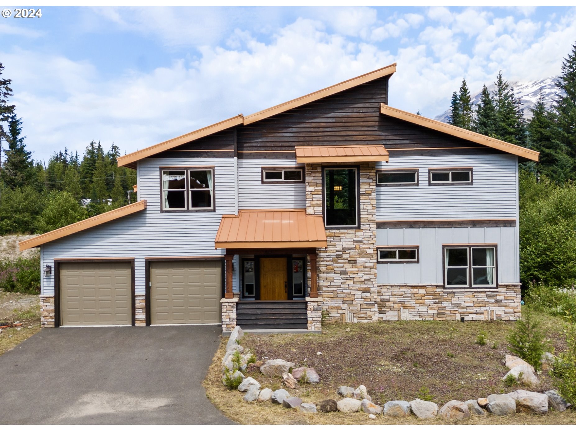 a front view of a house with garage