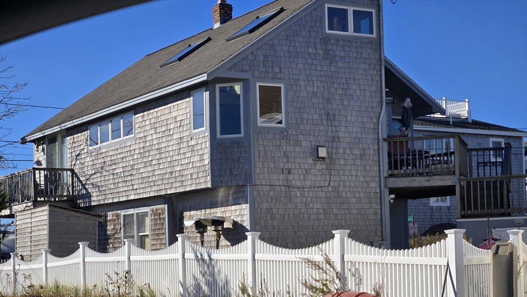 a front view of a house with glass windows