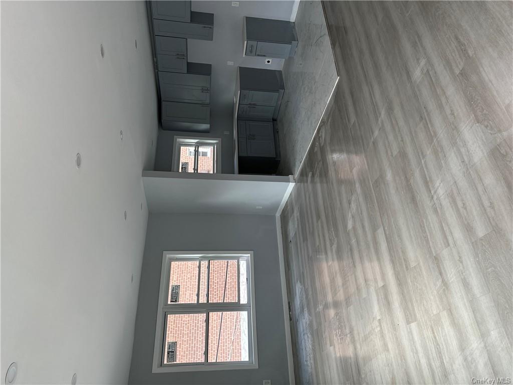 Unfurnished living room with light wood-type flooring