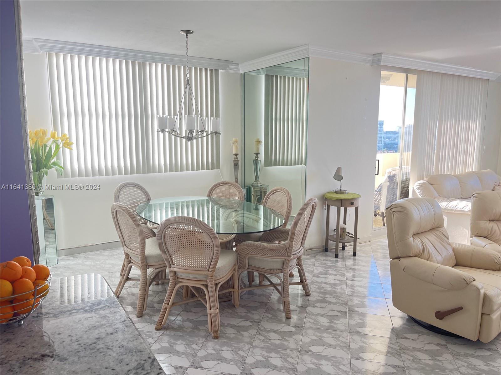 a view of a livingroom with furniture and windows