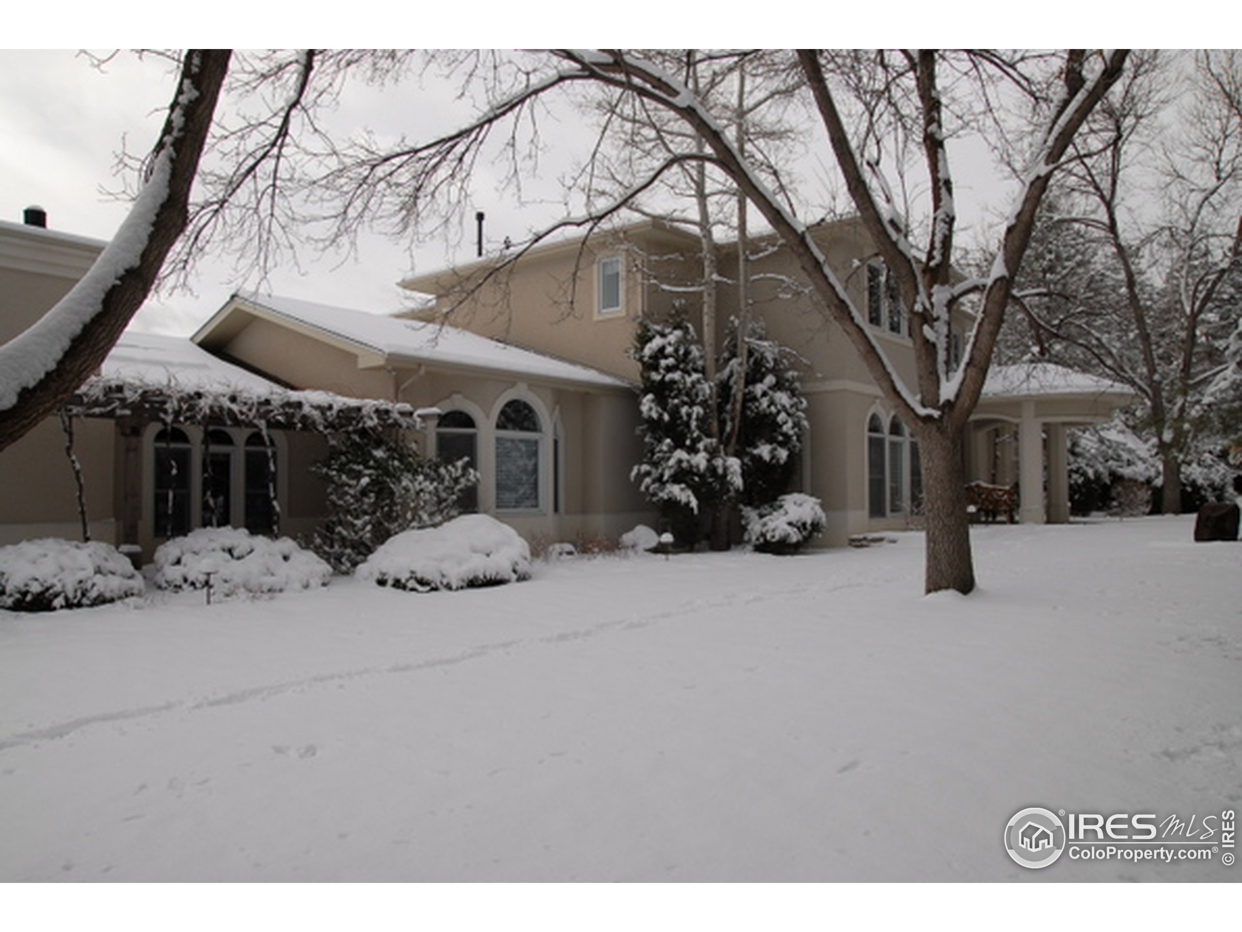 a view of a house with a snow in front of house