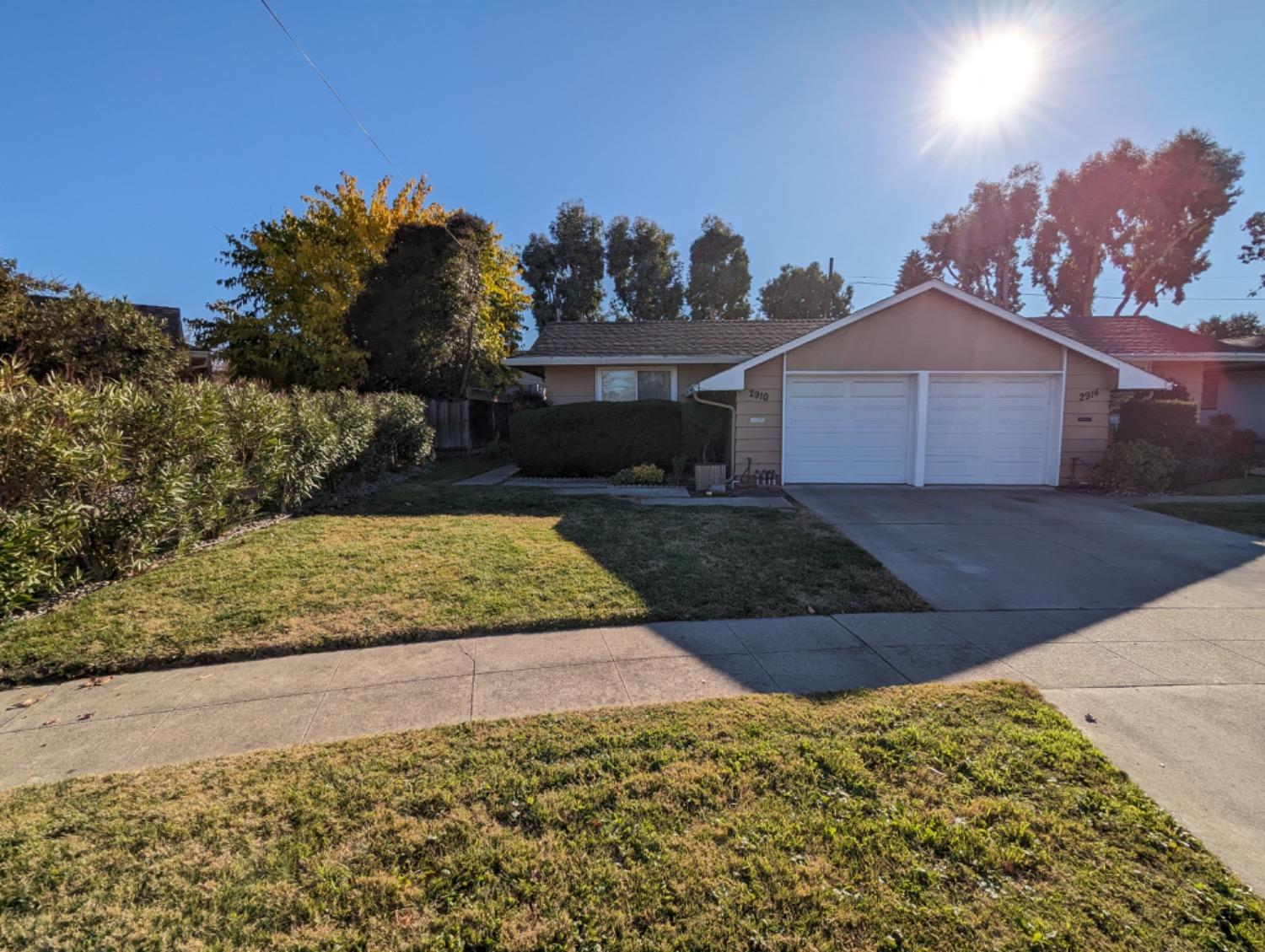 a view of a house with a yard