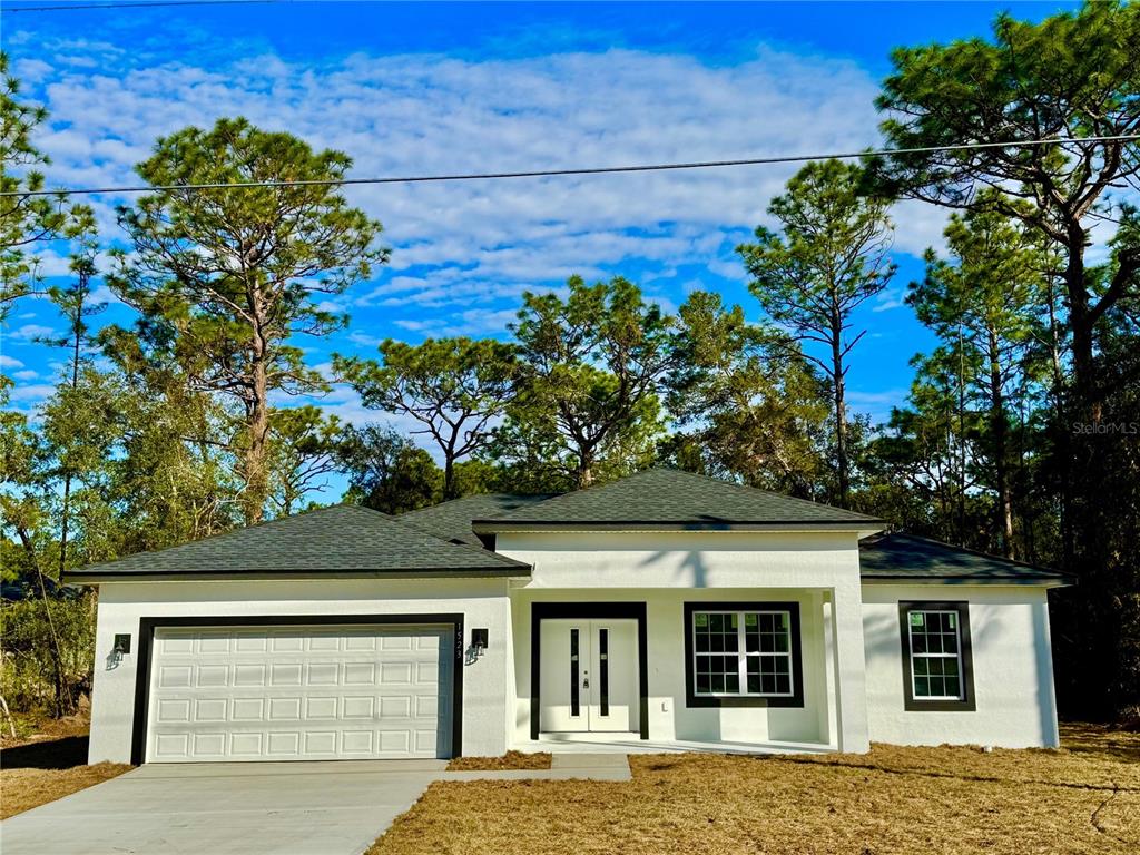 front view of a house with a garden