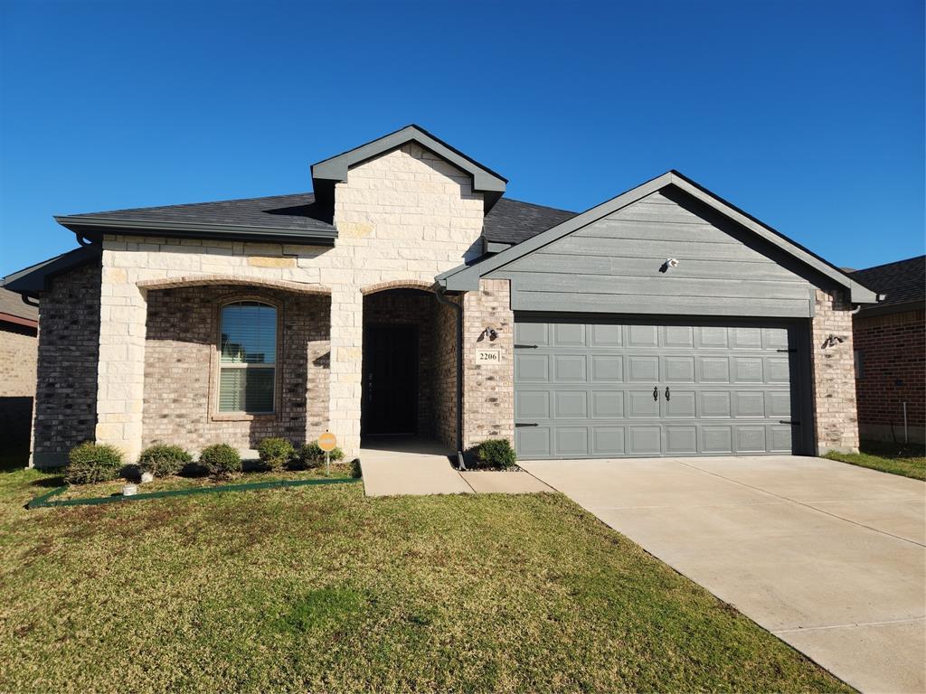 a front view of a house with yard