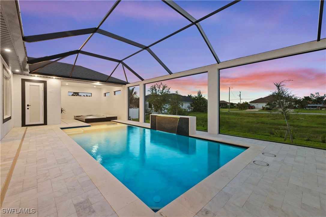 a view of a swimming pool with a yard