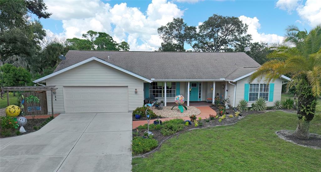 a front view of house with yard and outdoor seating