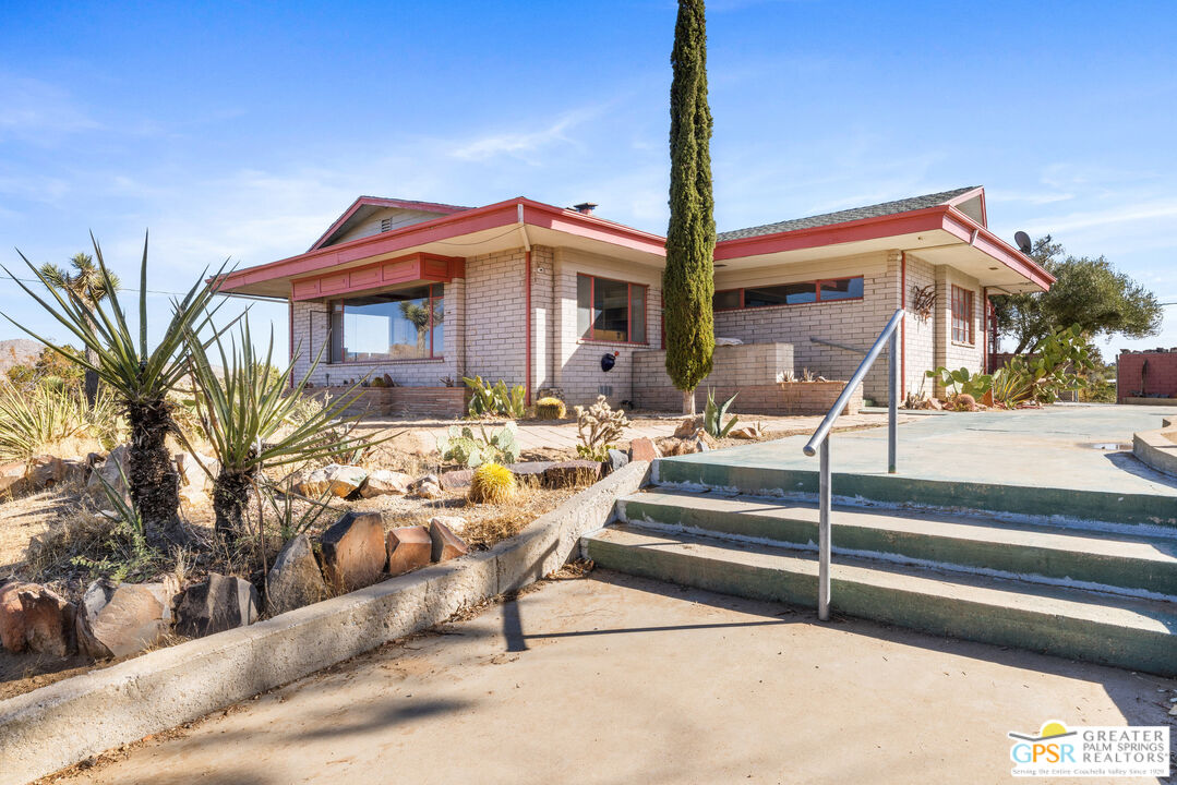 a view of house with outdoor seating