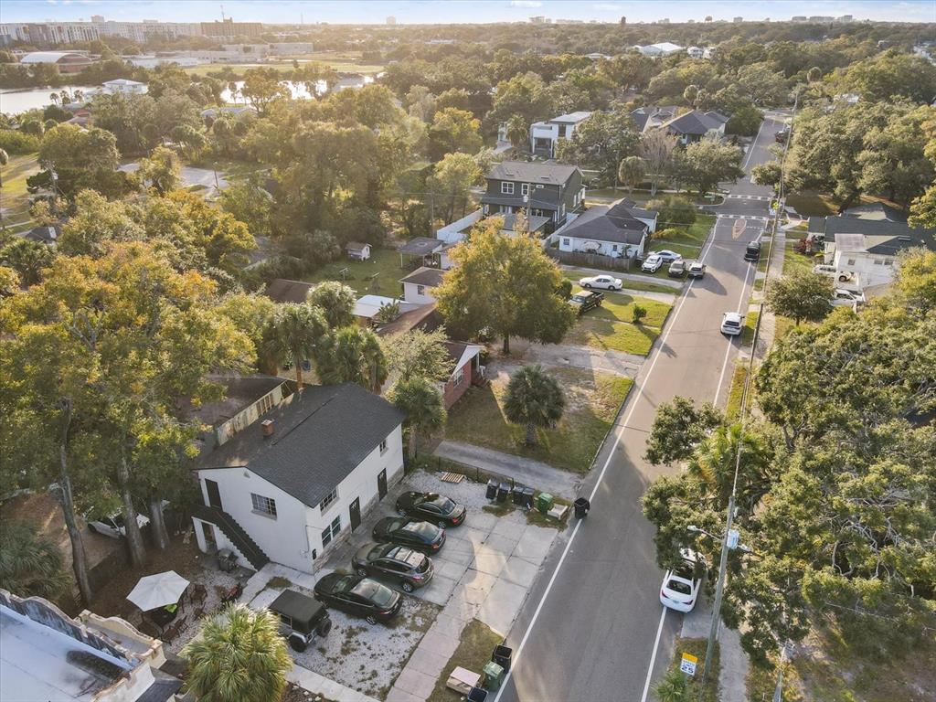 an aerial view of residential house with parking