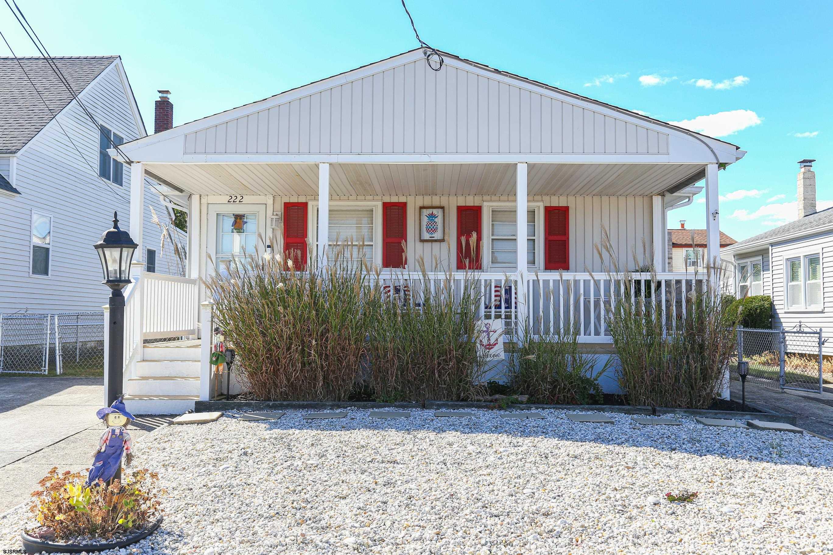 a front view of a house with a porch