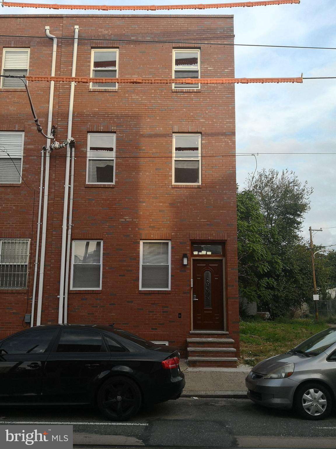 a view of a car parked in front of a building