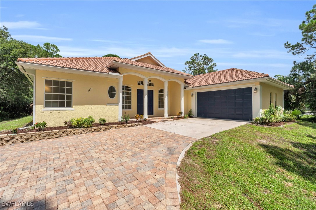 front view of a house with a yard