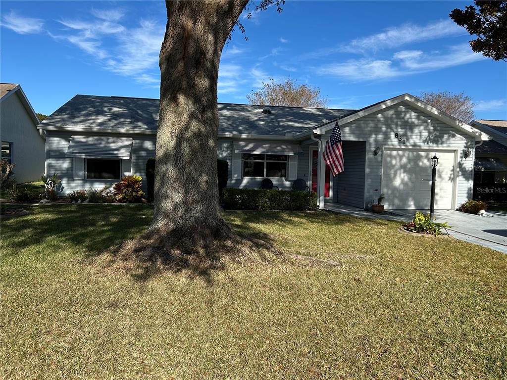 a view of a house with a yard