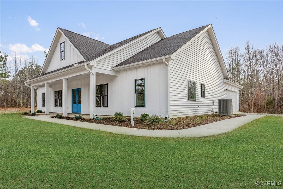 View of front of house with a porch, central air c