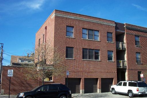 a front view of a house with parking