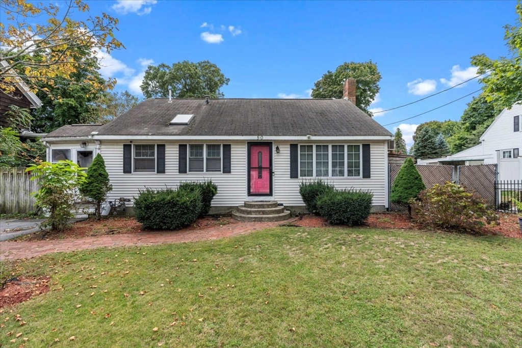 front view of a house with a yard