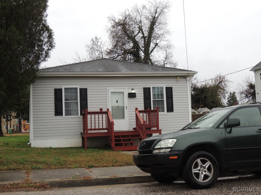 a view of a car parked in front of a house