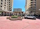 a view of multi story residential apartment building with yard