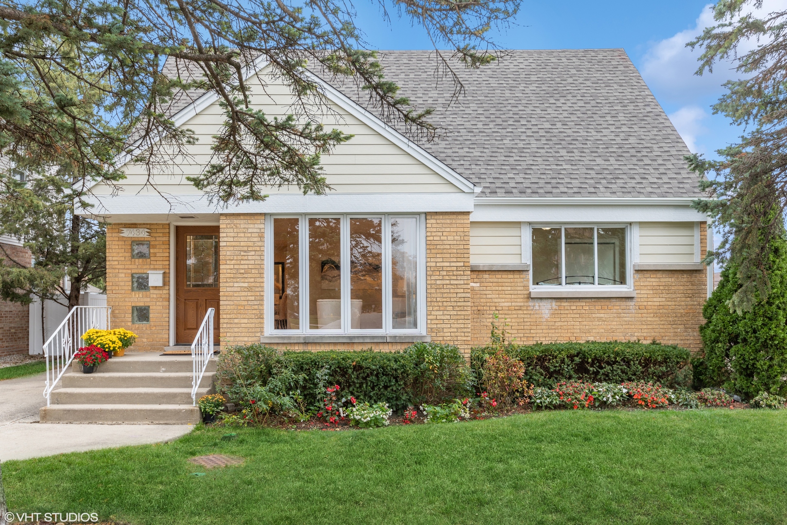 a front view of a house with a yard