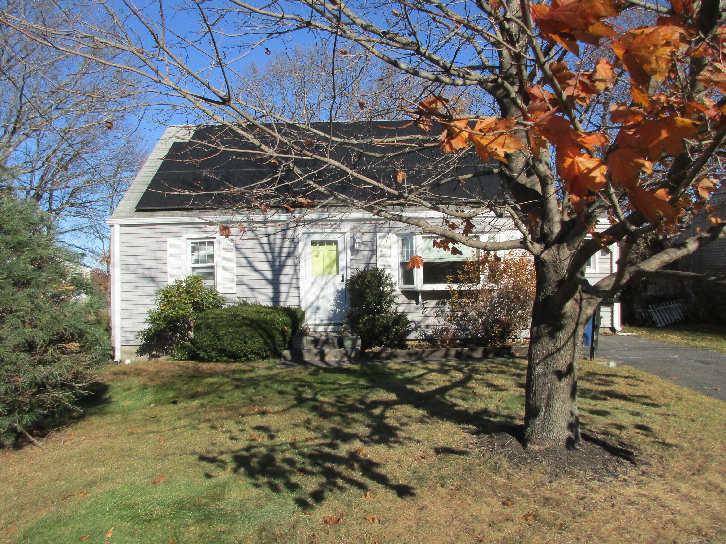 a view of a house with a tree