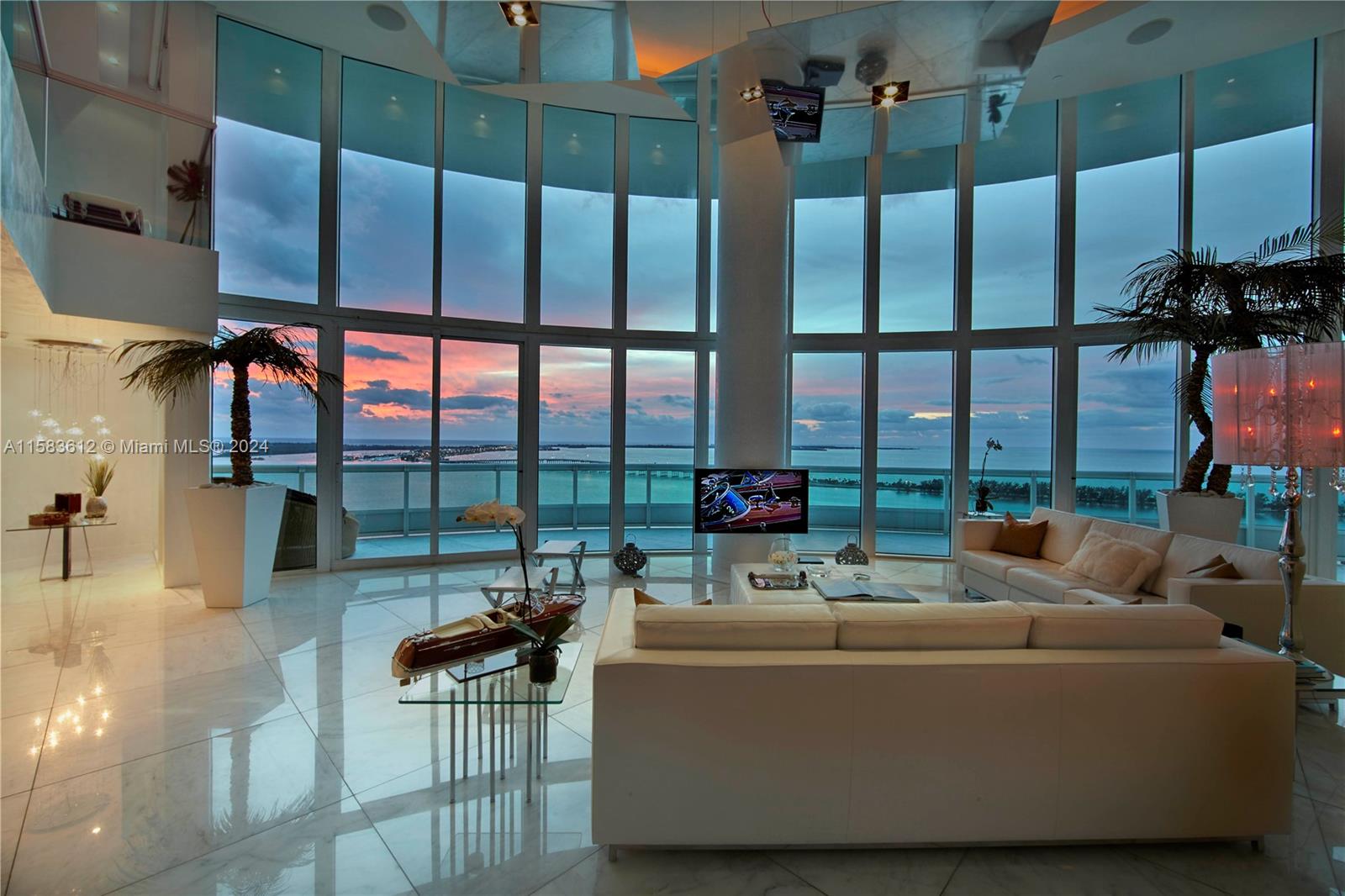 a living room with couch and a floor to ceiling window