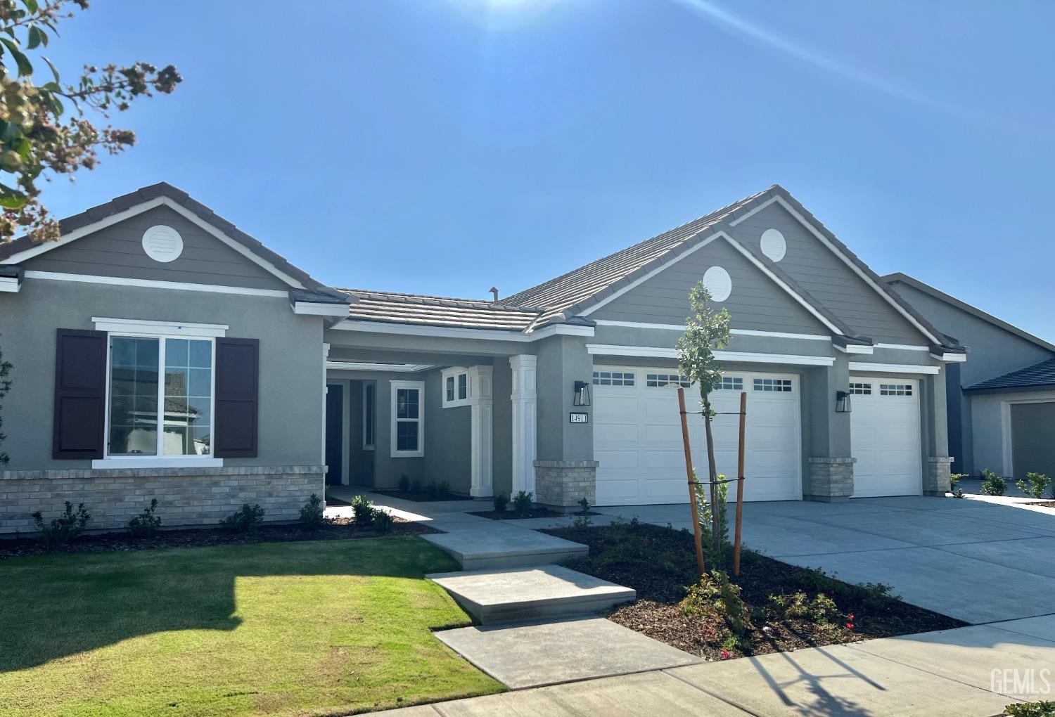 Elegant traditional street appeal, beautifully landscaped in the front yard includes automatic, programmable sprinkler and drip systems.