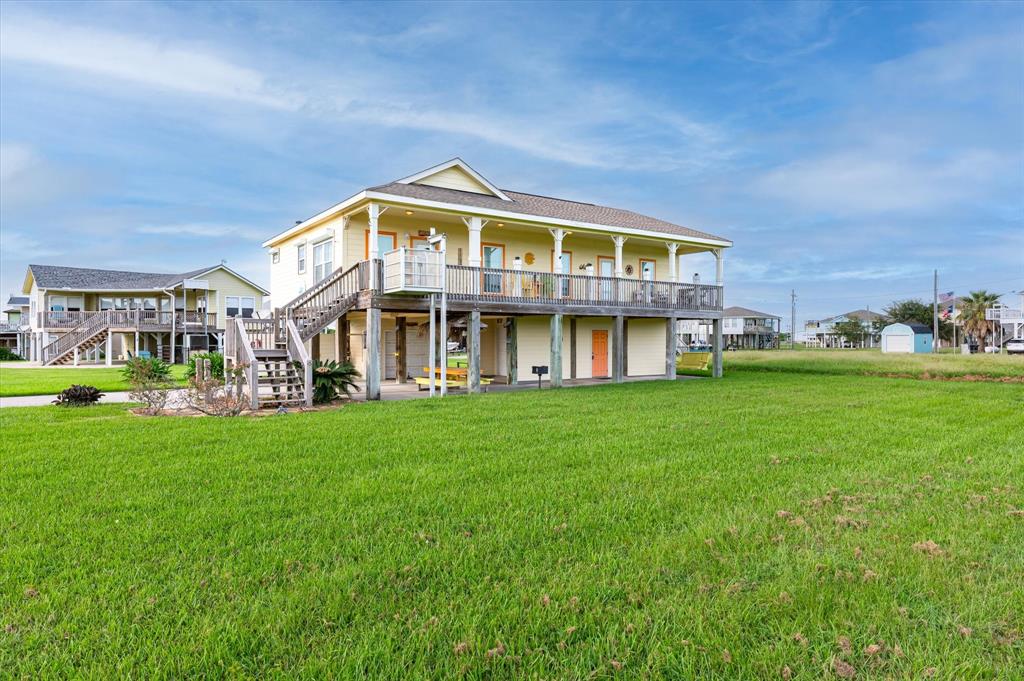 a view of an apartment with a garden and deck