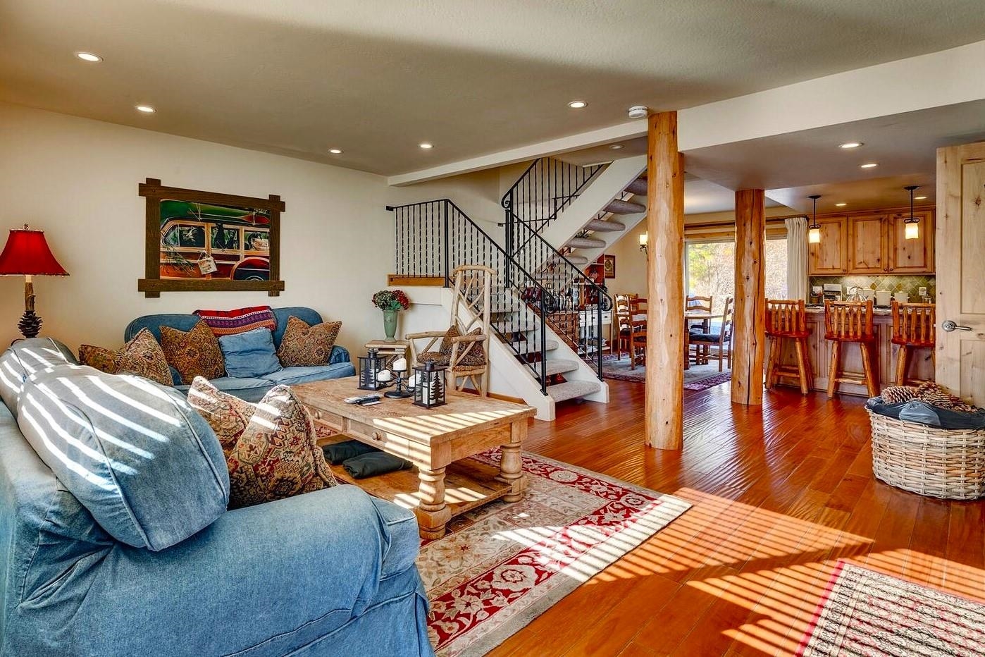 a bedroom with furniture and a wooden floor