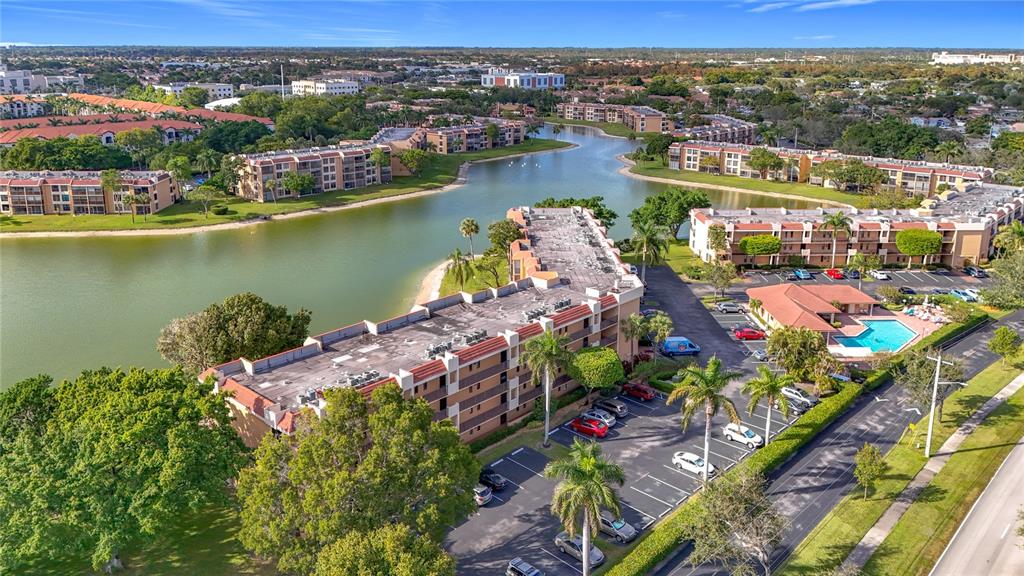 an aerial view of a houses with a lake view