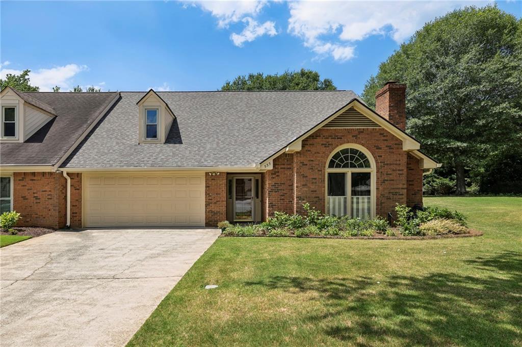 a front view of a house with a yard