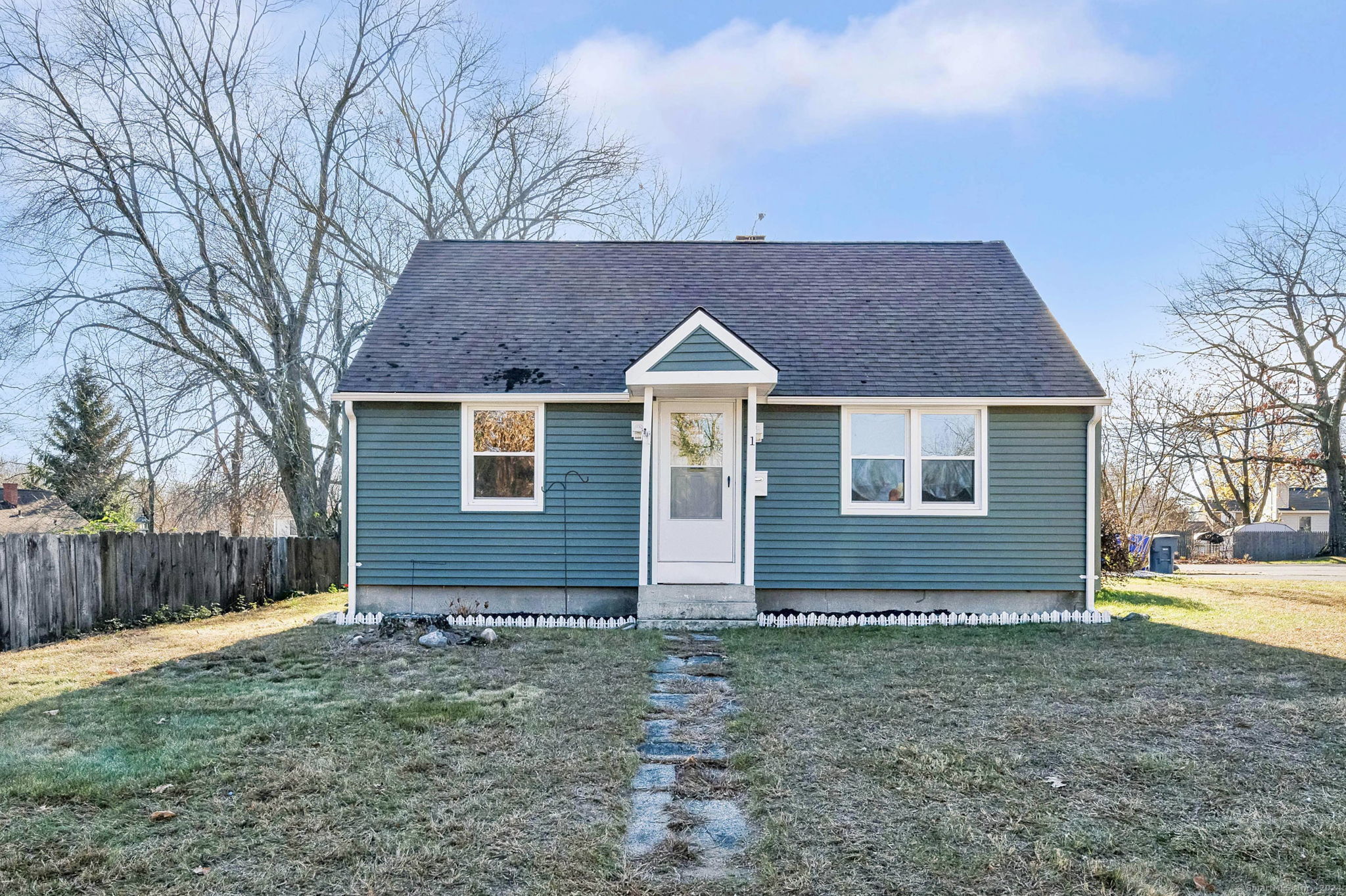 a view of a house with a yard