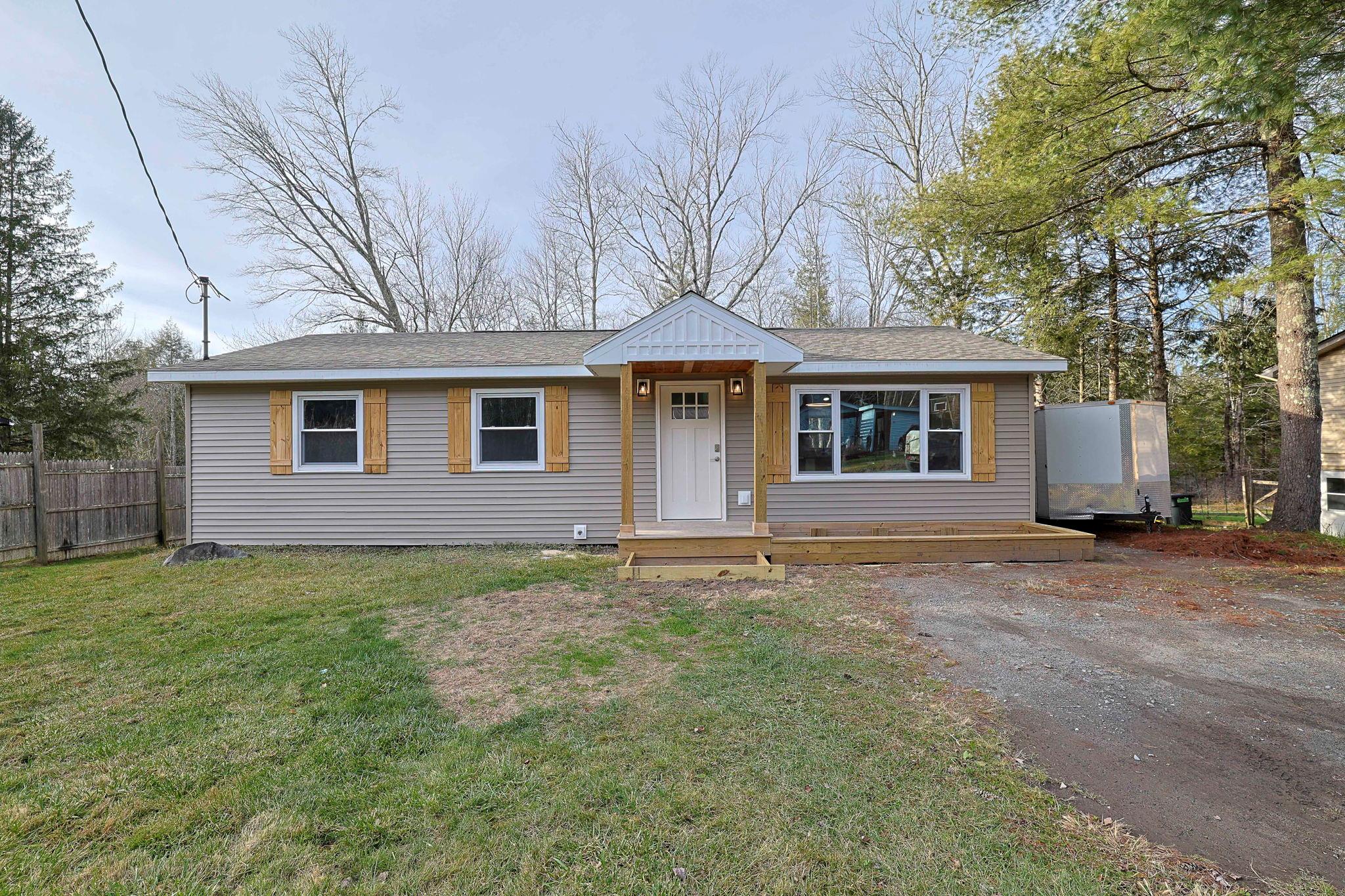 View of front of property with a front yard