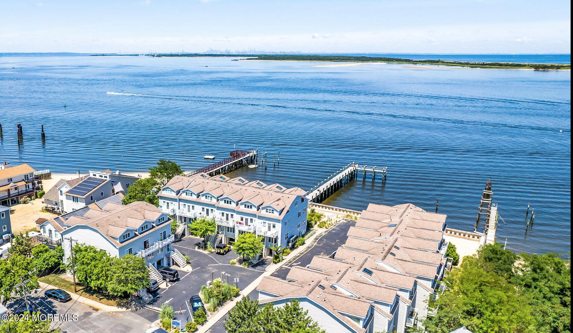 an aerial view of a house with a ocean view