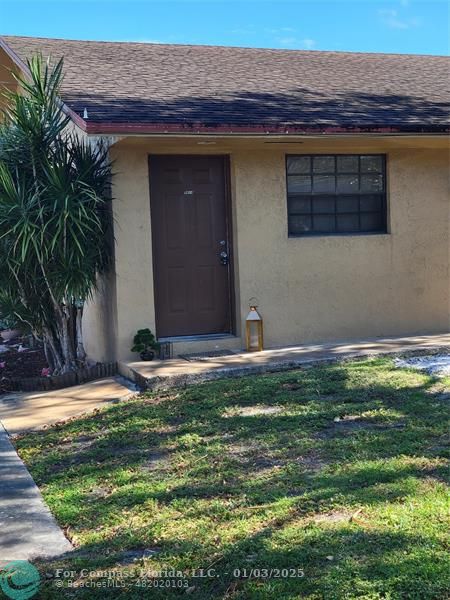 a front view of house with yard