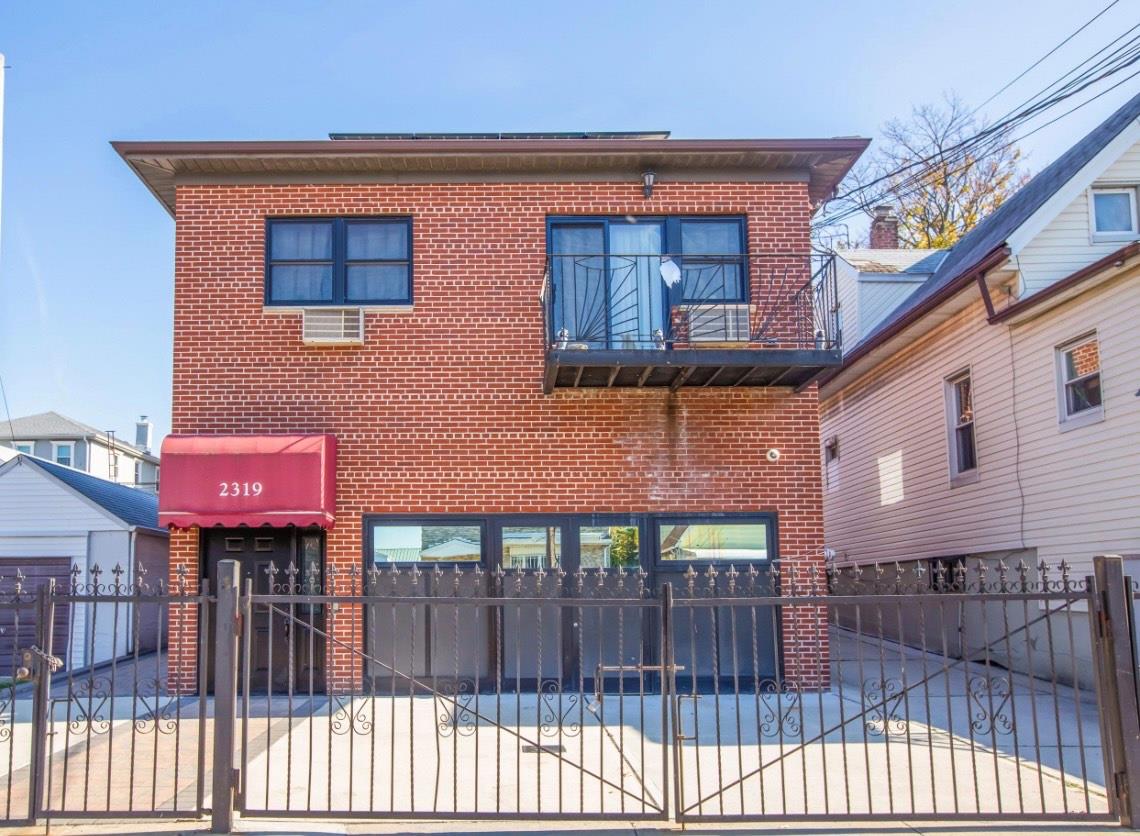 View of front of property featuring a balcony