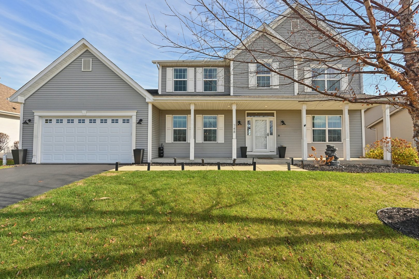 a front view of a house with a yard