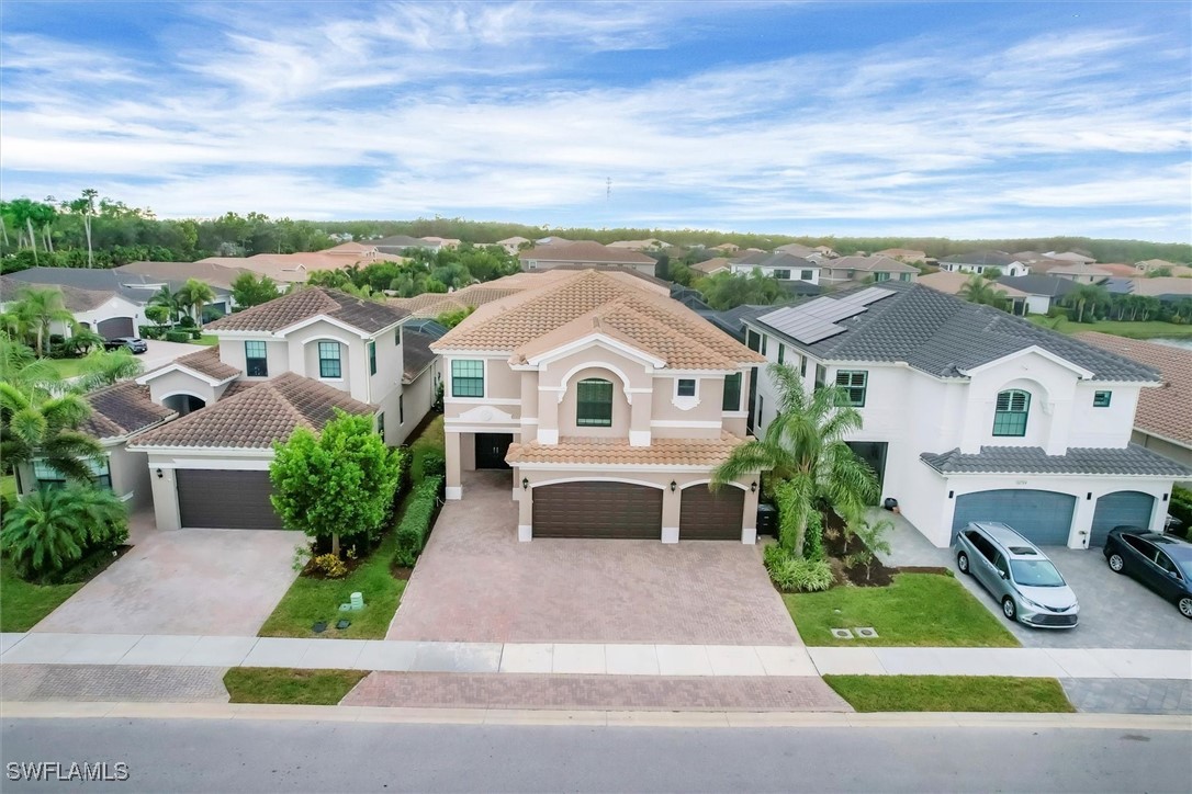 a aerial view of a house with a yard