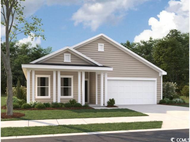 View of front of house with a garage and a front l