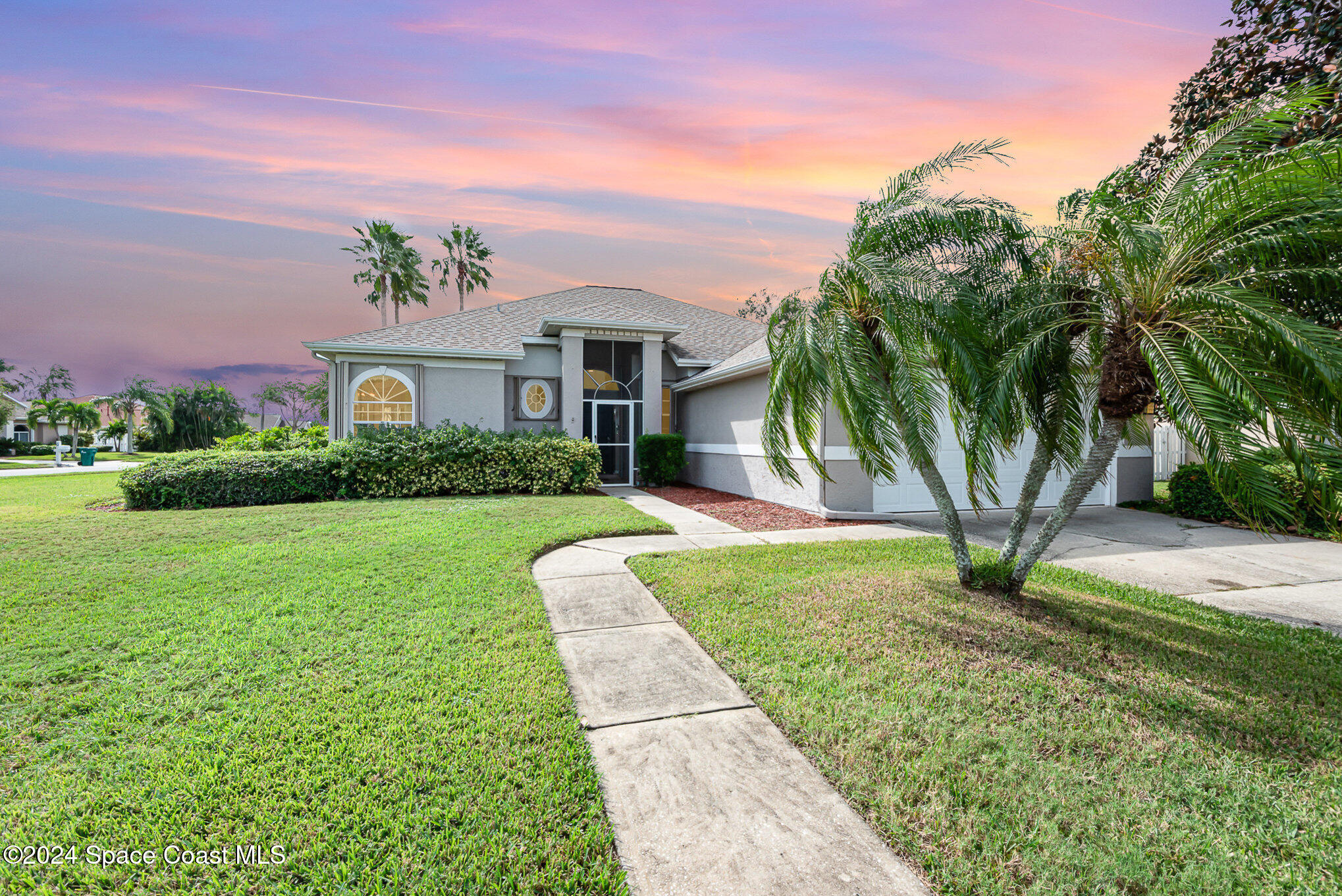 a front view of a house with yard