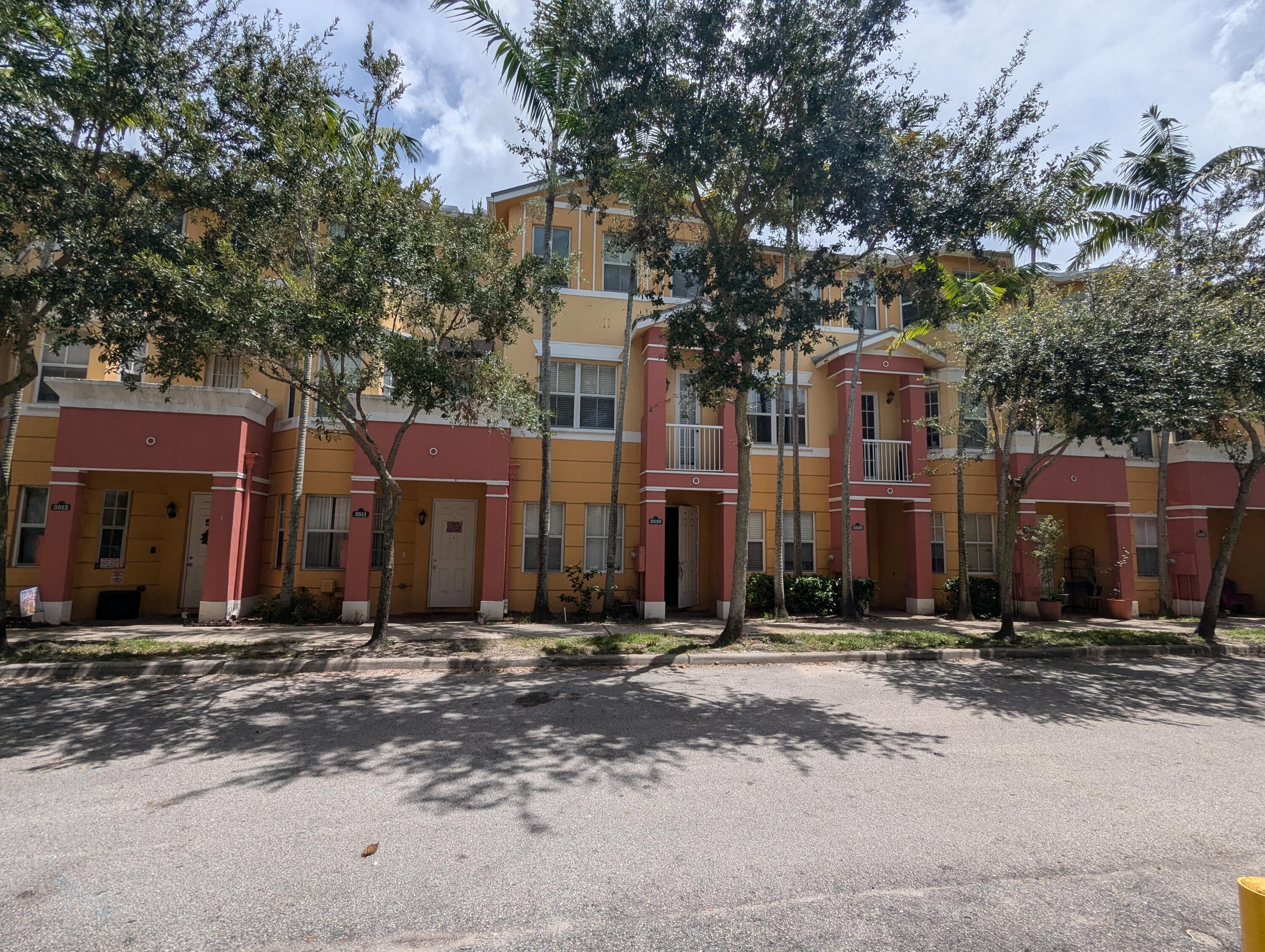 a front view of a building with street view