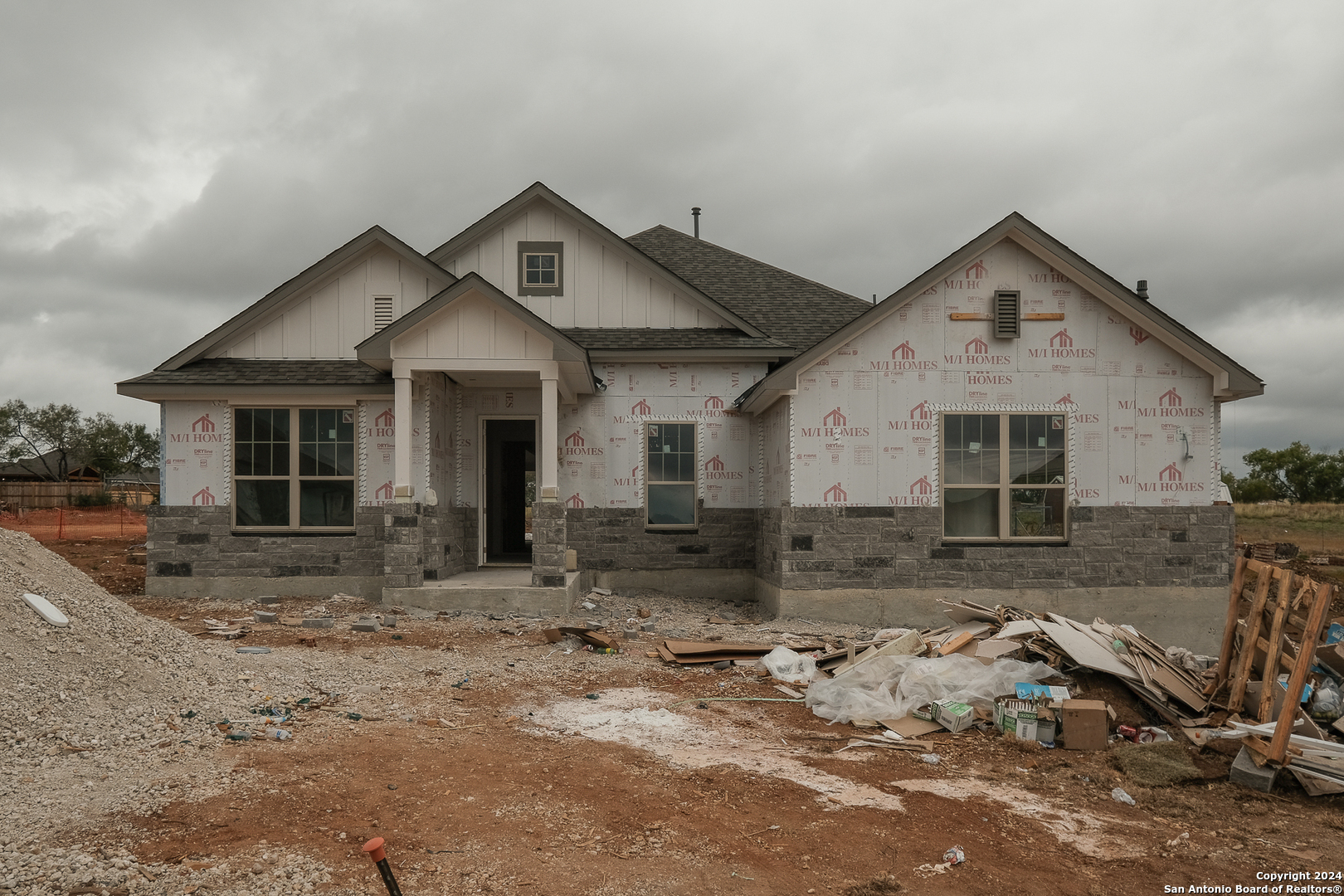 a front view of a house with yard and seating area