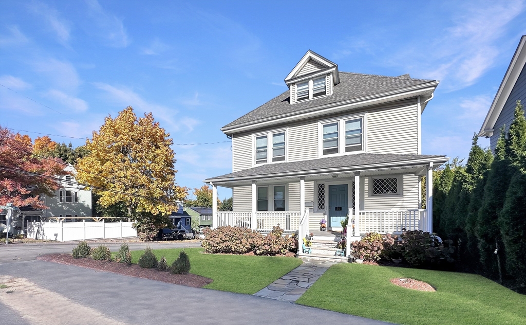 front view of a house with a yard