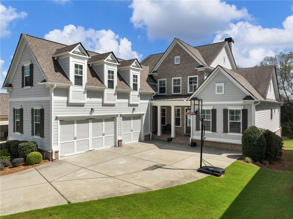 a front view of a house with a garden