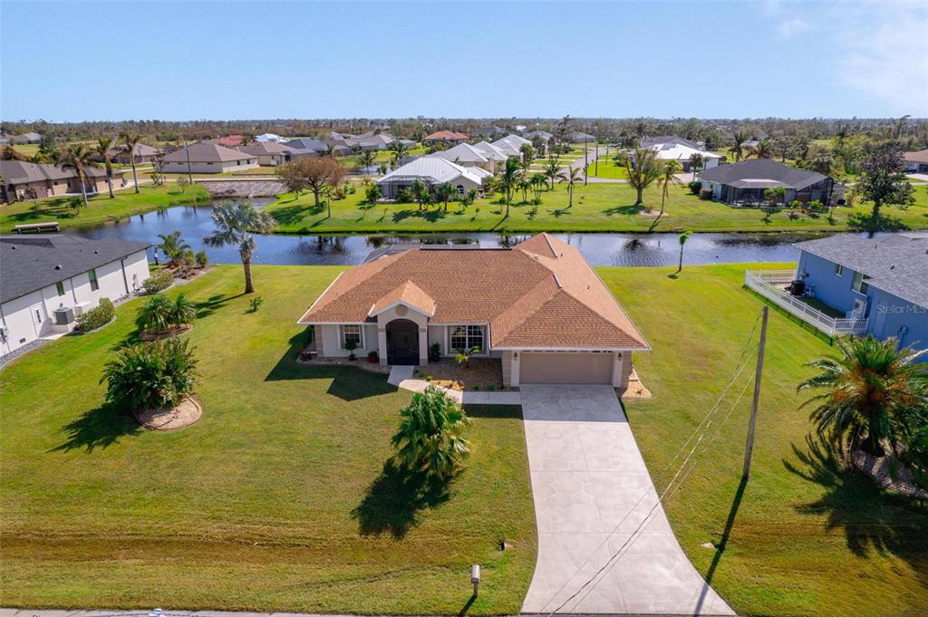 an aerial view of a house with a swimming pool