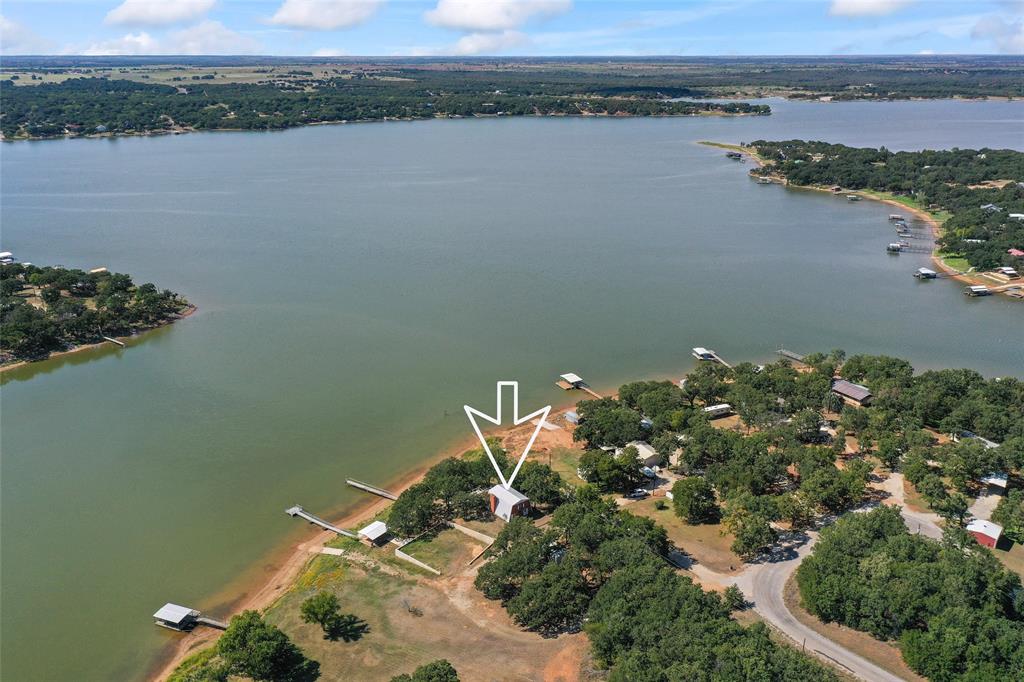 an aerial view of a house with a lake view