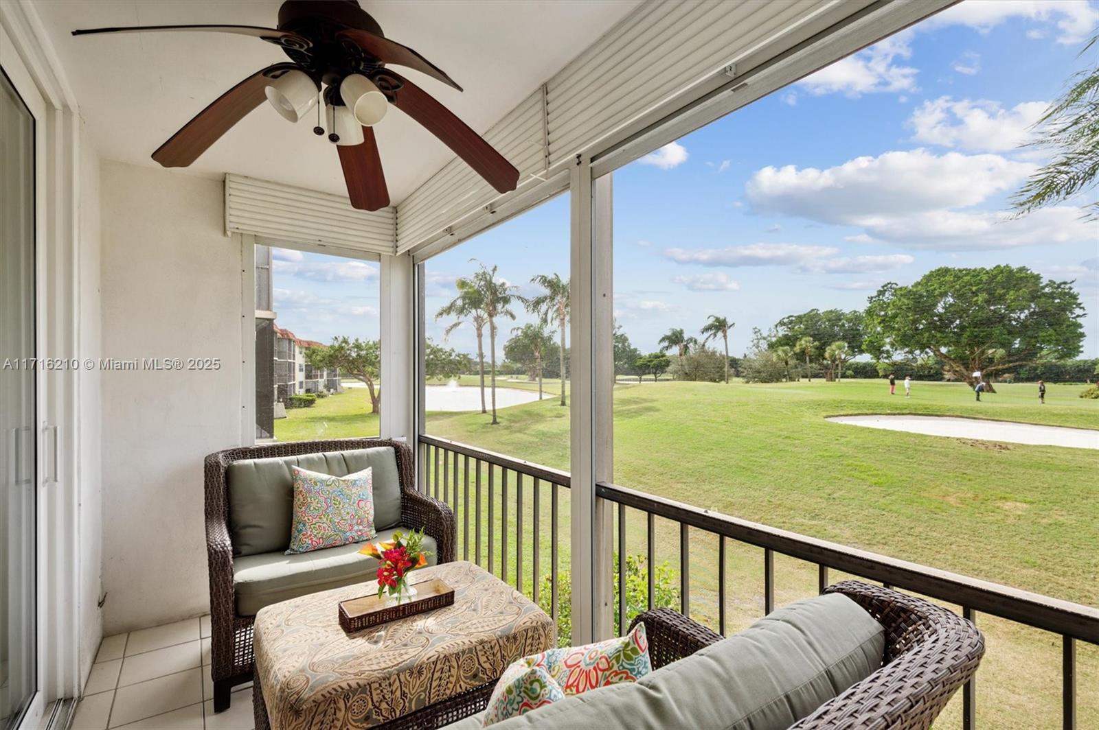 a balcony with furniture and garden view