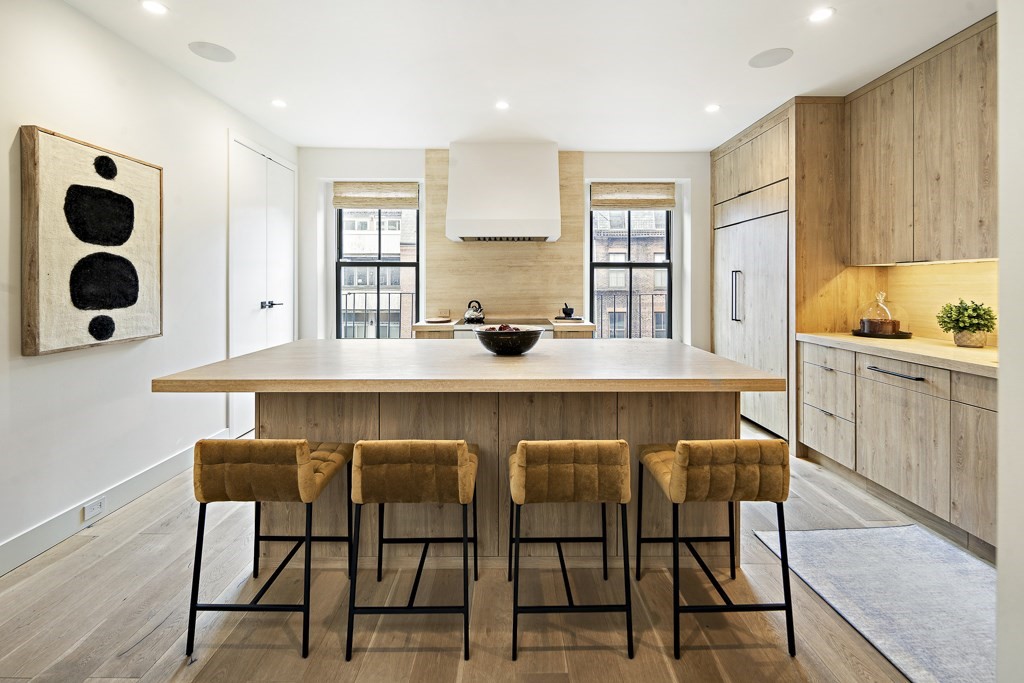 a dining table with chairs and window