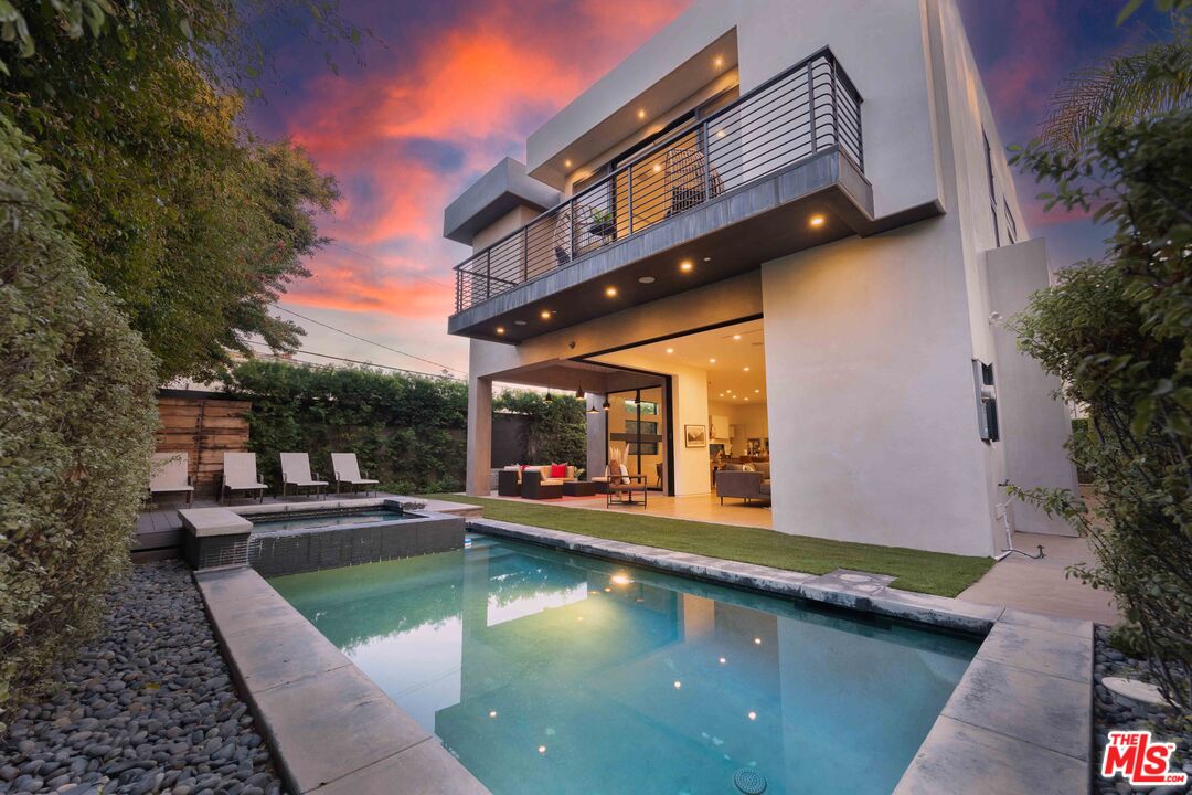 a view of a swimming pool with sitting area