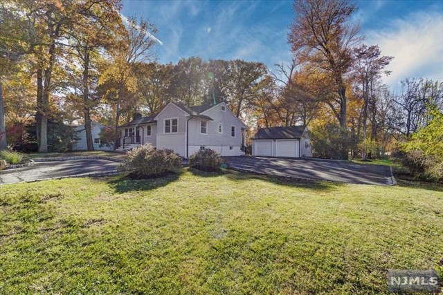 a view of a house with swimming pool and a yard